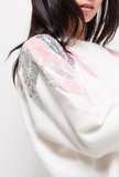 Trendy witte trui met motief in sequins._