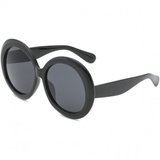Grote zwarte robuste vintage zonnebril._