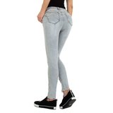 Licht grijze skinny jeans met enkelritsen._