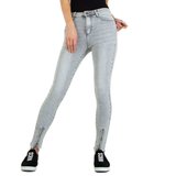 Licht grijze skinny jeans met enkelritsen._