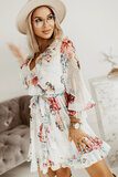 Prachtige korte licht beige jurk met bloemen print._