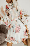 Prachtige korte licht beige jurk met bloemen print._