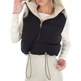 Korte omkeerbare beige bodywarmer._