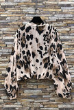 Trendy korte blouse met strik in cowprint_