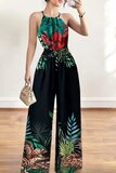 Fashion zwarte jumpsuit met tropical planten print_