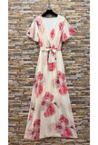 Elegante crème maxi jurk met roze bloemenprint en strikceintuur_