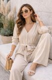 Beige elegante jumpsuit met strikceintuur_
