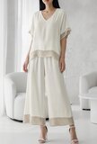 Breige viscose set met gehaakte details_