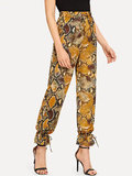 Exclusieve broek met slangenprint._