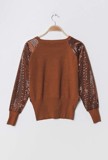 Trendy terracotta trui met pailletten.