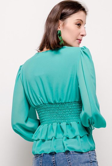 Trendy korte groene blouse.