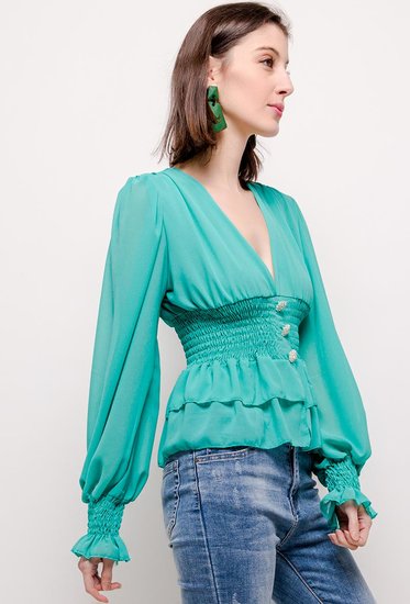 Trendy korte groene blouse.