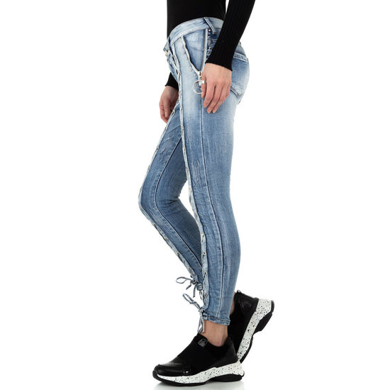 Fashion skinny jeans met veters.