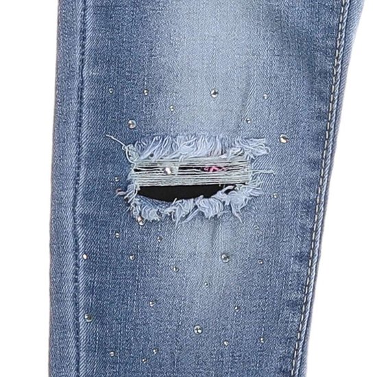 Trendy blauwe meisjes jeans destroyed.