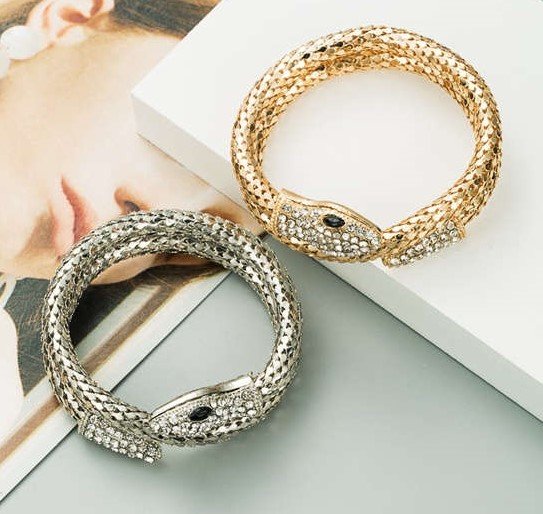 Fashion gouden snake armband met witte strass.