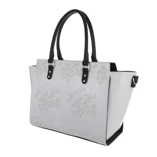 Trendy witte shopperbag met decoratie.