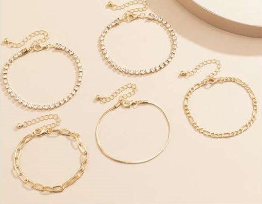 Trendy 5 delige gouden-zilveren fijne armbanden set.