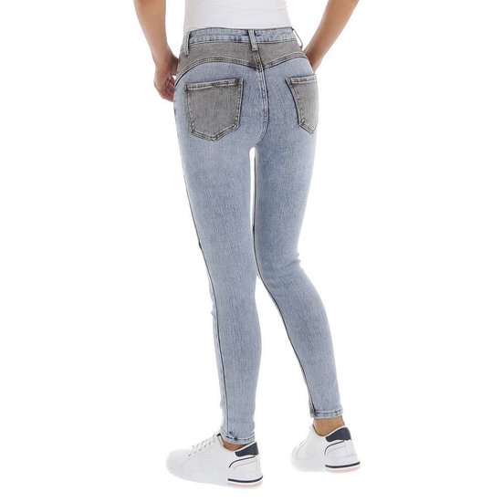 Trendy grijs-licht blauwe skinny jeans met hoge taille.