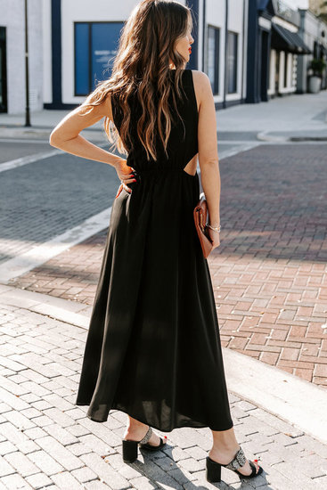 Trendy zwarte cut out maxi jurk.