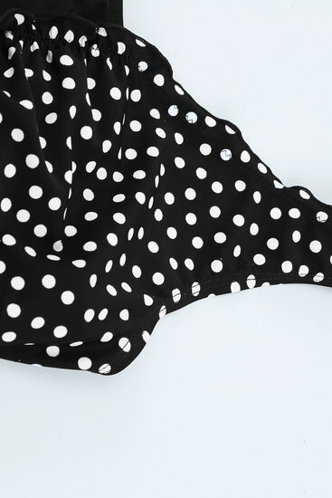 Maillot de bain noir à pois.