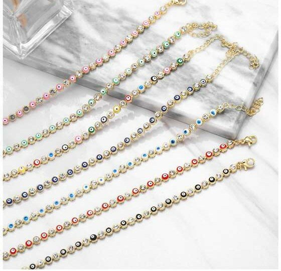 Goldplated armband met multi colour beads en zirconia steentjes.