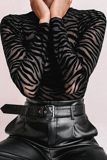 Zwarte bodysuit met zebraprint.