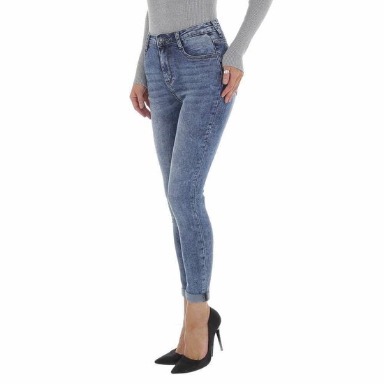 Skinny blue jeans broek met beer deco.