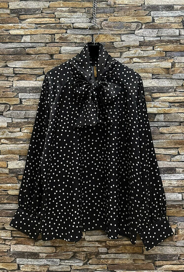 Elegante zwarte blouse met stippen en strik