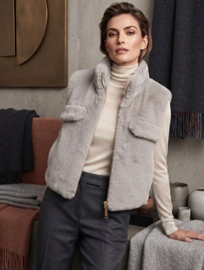 Licht grijze bodywarmer in teddy fleece