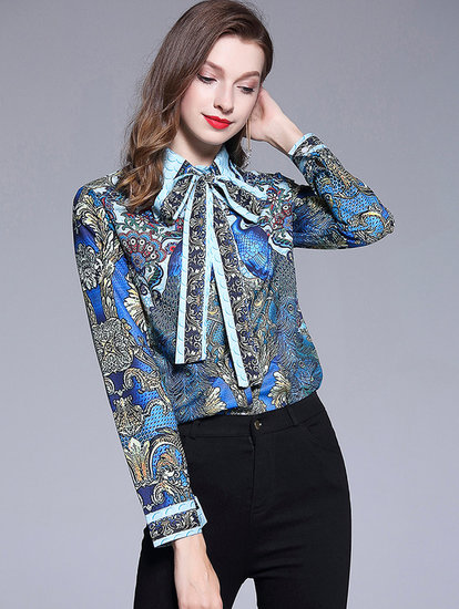 Elegante blouse met trendy striksluiting.