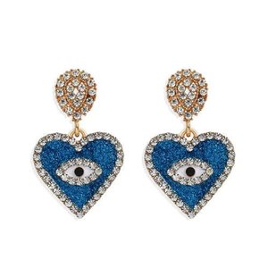 Blauwe oorbellen in hartvorm met oog en strass.