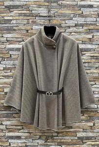 Elegante beige-zwarte cape jas